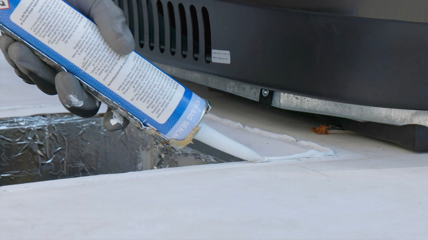 Installing roof gasket with self-leveling silicone around opening