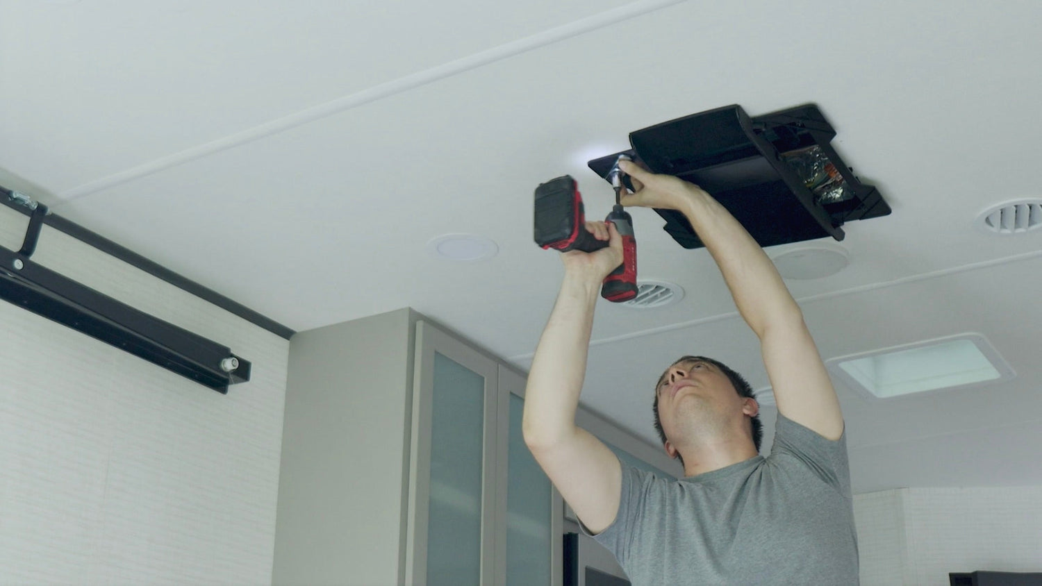 Installing plenum mounting bracket and bolts on RV ceiling